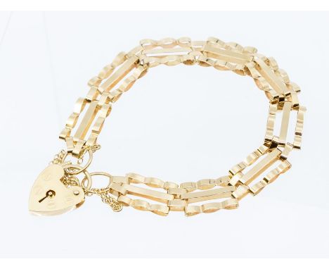 A 9ct gold three bar gate bracelet with padlock clasp, weight approx 7.2gms Condition report: Good, some minor wear and tear 
