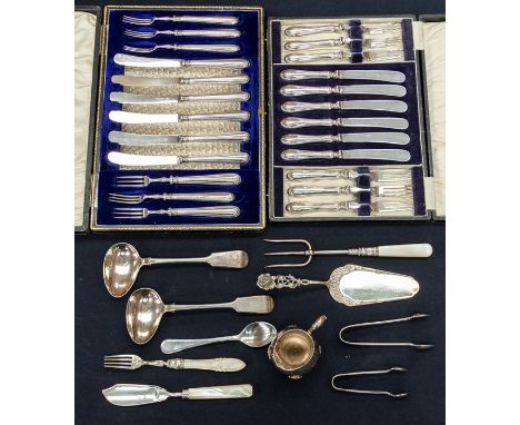 An Edwardian set of six fruit knives and forks, silver handles by William Hutton &amp; Sons, Sheffield, 1910, in fitted case 