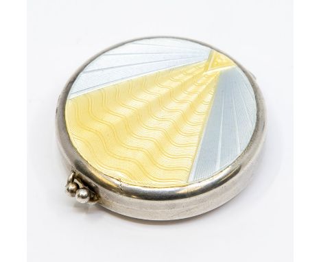 An Art Deco silver and enamel compact, the cover with sunbeam within blue radial design, mirror to interior cover, stamped 22