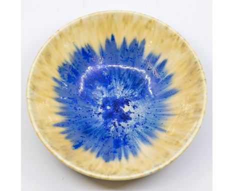 A Ruskin Crystalline glazed bowl, circa 1930, relief moulded dish form with three bracket feet, cream and blue, impressed mar