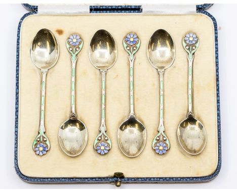 A cased set of six George V Walker & Hall silver-gilt and enamel demitasse spoons, the terminals set with blue flowers - forg