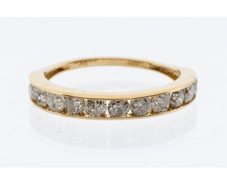 A 9ct gold and diamond half set eternity ring, the front channel set with eleven round brilliant cut diamonds, with a total d