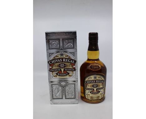 A Bottle Of Chivas Regal 12 Year Blended Scotch Whisky.  In Presentation Box Box Has Slight Signs Of Creasing, But In Overall