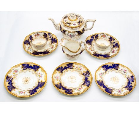 A Coalport cobalt blue Batwing pattern no: 2665 part tea service to include: four cups, two saucers, teapot, cream jug, sugar