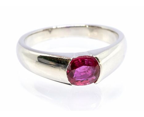 A ruby and platinum set dress ring, comprising an oval ruby approx 5.4 x 6 x 2.5mm, size N1/2, 8.3gms Condition report: Good-