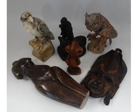 A naive carved treen tourist ware figure, approx 16.5cm high; a Kenya tourist ware mask, approx 24cm; a carved hardstone scul