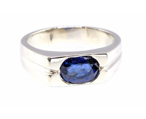 A sapphire and platinum dress ring, the flat top set with an oval sapphire approx 7.7 x 5.5 x 3.6mm, split details to the sho