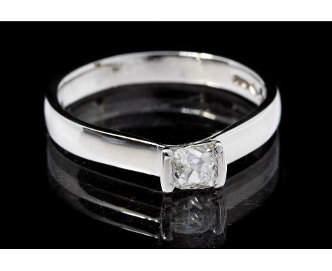 An old cut diamond solitaire platinum ring, comprising an old cushion cut diamond approx 0.28ct, tension setting, size N, tot