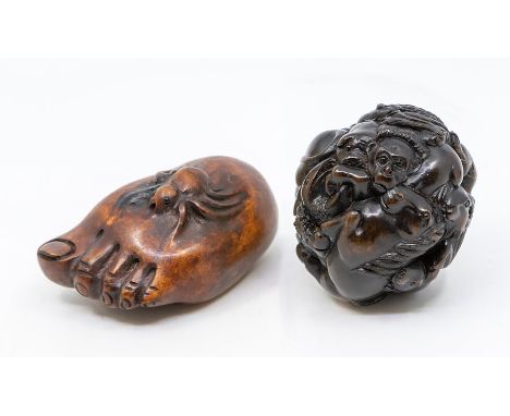 A Chinese carved hardwood ball (netsuke), depicting the twelve signs of the Chinese Zodiac, including rat, tiger, ox, rabbit,