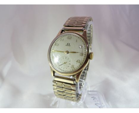 A gents' 9ct gold cased Omega watch. 15 Jewels. Dennison case marked Birmingham 1948, with a Speidel expandable bracelet. Wor
