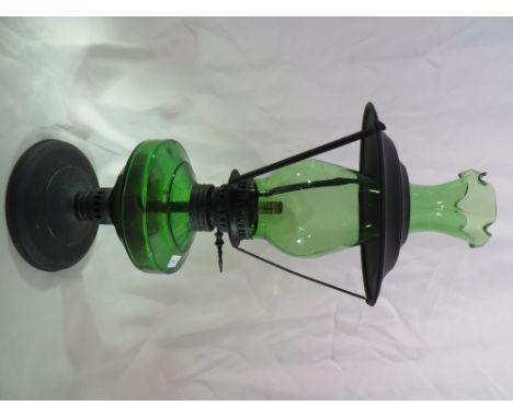 A green glass oil lamp.