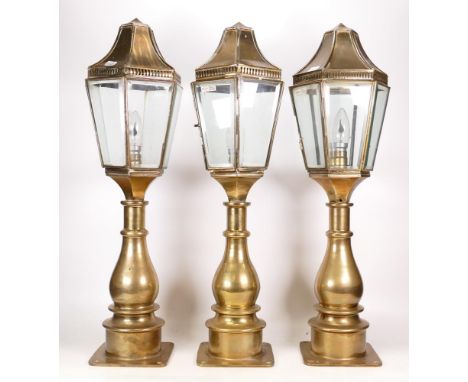 Three Matching Brass Outdoor Pillar Lamps in the style of Georgian Examples. One lamp is missing a panel. Height: approx. 60c