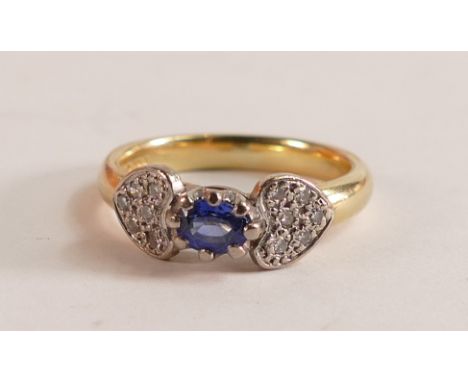 18ct diamond &amp; sapphire ring, heart shaped diamond cluster shoulders with centre oval sapphire, size L/M, 5.8g. 