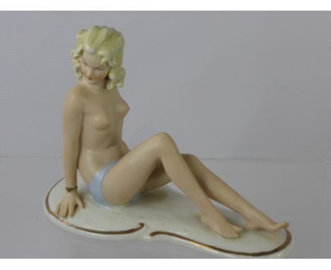 A Continental Bisque "Bathing Beauty", with factory marks to base nr. 960, approx 20 x 16 cms.