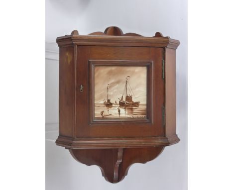 An Edwardian Mahogany Miniature Corner Cabinet, the cabinet having a hand painted tile to front, signed bottom right, depicti