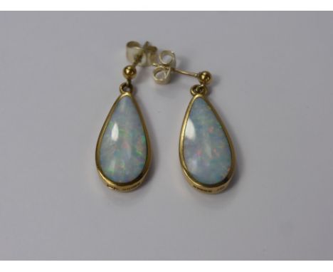 A Pair of 9 ct Gold Tear Form Opal Drop Earrings, approx 20 x 10 mm, approx total wt 3.7 gms.