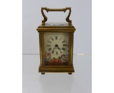 A Miniature French Brass Hand Painted Carriage Clock, porcelain side panels depicting cherubs catching butterflies, hand pain