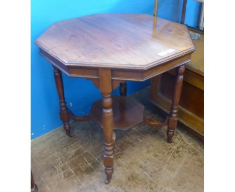 A Mahogany Victorian Octagonal Table, on turned legs with curved supports on lower shelf, approx 74 x 75 cms.