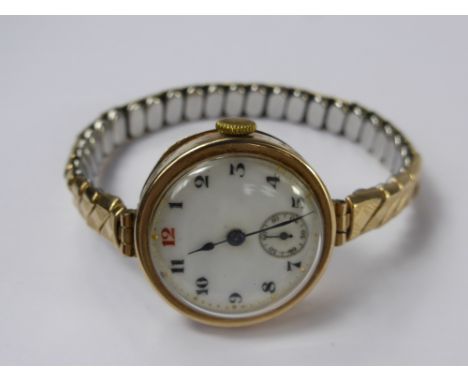A Lady's 9ct Gold Pocket Watch, the open faced vintage pocket watch, having white enamel face with minute dial, case number 3