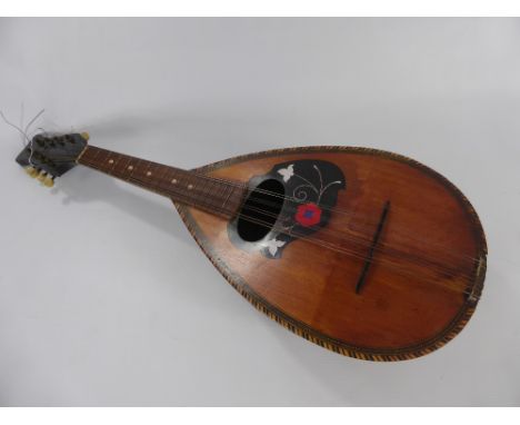 A Vintage Neapolitan Guiseppe Quaglia Mandolin, circa 1900 the eight string mandolin with decorative inlay and marquetry surr