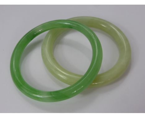 A Lady's Celadon Green Chinese Glass Bracelet, approx 47.5 gms, approx 8.5 dia together with another Chinese Jade/Hard Stone 