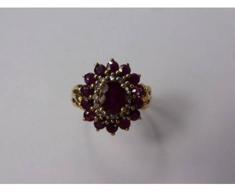 A Lady's 9 ct Gold Ruby and Diamond Ring, size N, approx 3.4 gms, 11 m x 1 pt dias, 14 x 2.5 mm rubies, 1 x 6.7 x 5 mm ruby.