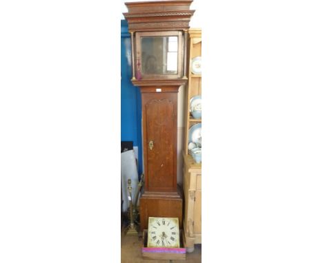 An Antique Long Case Clock. The clock having an oak case with a mahogany column support and having floral sprays to top with 