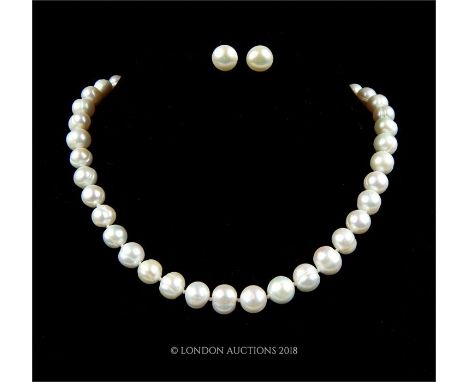 A 14 ct yellow gold clasped, South Sea Akoya white pearl necklace and matching earrings, Necklace length: 22.5 cm, Earrings: 