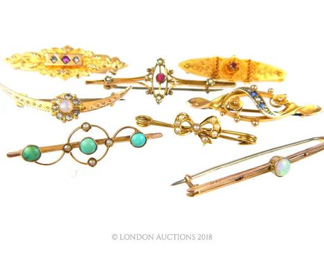 A collection of 15 ct and 9 ct yellow gold, antique brooches to include a 9 ct ruby and diamond gold bar brooch, a 15 ct ruby