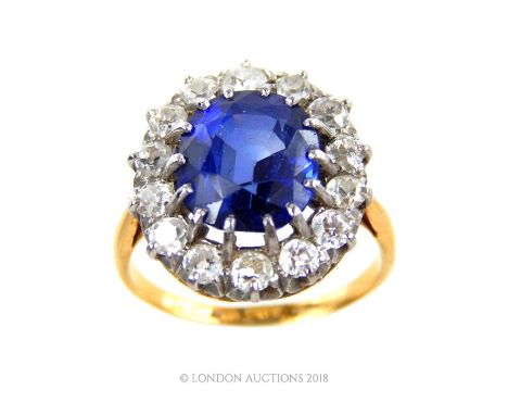 A ladies gold, sapphire (4.8ct) and diamond (1.25ct total) ring, 