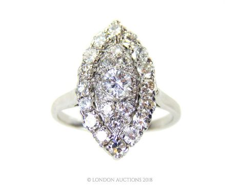 An 18 ct white gold, Art Deco, French, diamond, marquise-shaped ring, composed of a central, brilliant cut diamond, an outer 