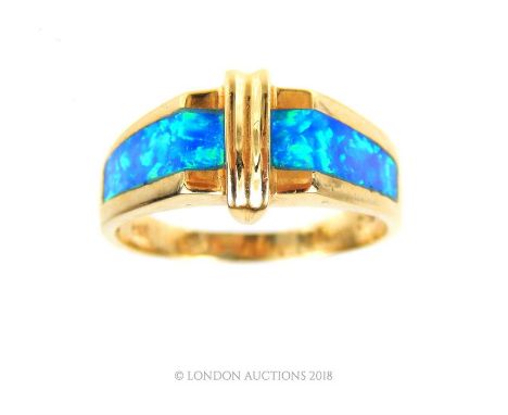 A 14 carat yellow gold and blue opal matrix ring, featuring a stepped, Art Deco style design to a round shank, Size: Q 1/2, W