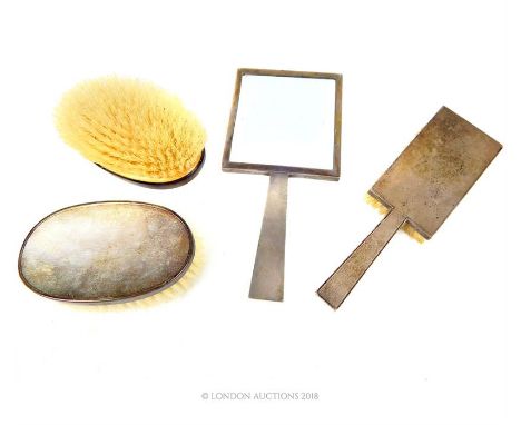 A matching Art Deco sterling silver hair brush and hand mirror, William Comyns & Sons Ltd, London 1946, with engine turned de