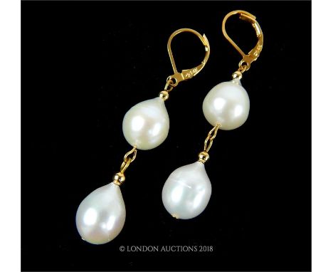 A pair of fine, boxed, South Sea Akoya pearl, drop earrings, each earring composed of a secure, hinged, 14 ct yellow gold fas