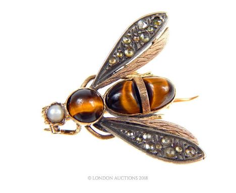 An 18 ct yellow gold, Victorian, bee brooch, the abdomen of the insect set with three polished tiger's-eye cabochons, a natur