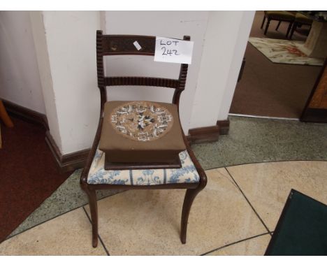 Ornate bar back chair together with a foot stool 