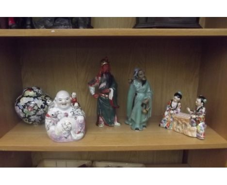 Shelf of oriental figures