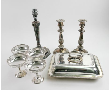 A pair of Old Sheffield plate candlesticks, with campana shape scones, baluster stems, shell 'c' and leaf scroll ornament, 23