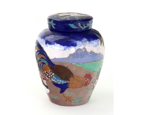 Daniel Zuloaga (Spanish, 1852-1921), A ceramic vase and cover, decorated with a cockerel, hen and other birds in a landscape,