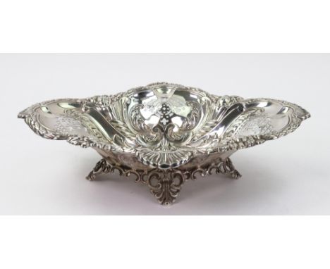 A late Victorian silver shaped oval fruit dish, Harry Wright Atkin, Sheffield 1899, embossed with flowers, fruits, shells and