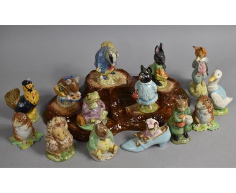 A Collection of 14 Various Beswick Beatrix Potter Figures together with a Tree Trunk Stylised Stand 