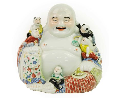 A large Chinese porcelain model of Buddha, 20th century. With five boys and oval seal mark to base, height 26cm, width 25.5cm