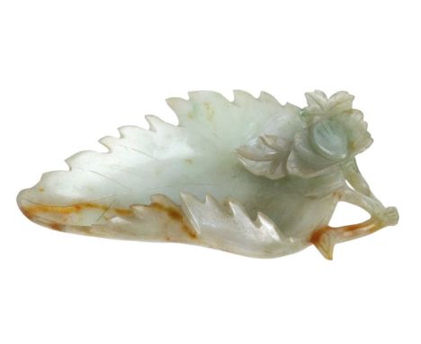 A Chinese carved jade dish, Qing Dynasty, 19th century. In the form of a leaf, with russet inclusions, height 1.5cm, width 12