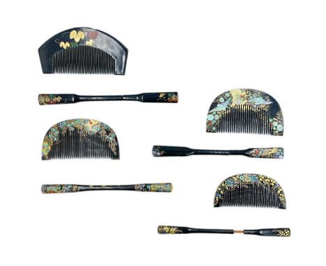 Four Japanese black lacquer, gilt and mother-of-pearl combs and kogai. Each cased, largest comb length 11.2cm. (4)From the co