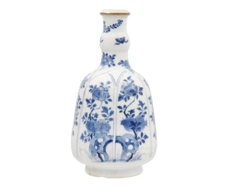 A Chinese blue and white hookah base, Kangxi, 1662-1722. The bell-shaped body painted with stylised flowers, artemisia leaf m