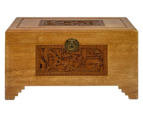 A Chinese camphor wood chest, 20th century. With rectangular panels carved with figures in a garden setting, height 58cm, wid