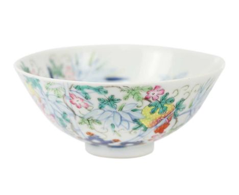 A Chinese famille rose porcelain bowl, 19th century. Floral and bamboo decorated, Qianlong mark to base, height 4.7cm, diamet