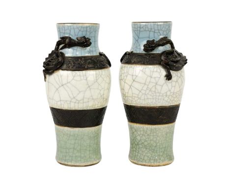 A pair of Chinese crackle glaze vases, circa 1890. Each vase decorated in relief with a dragon, seal mark, height 26.5cm, wid