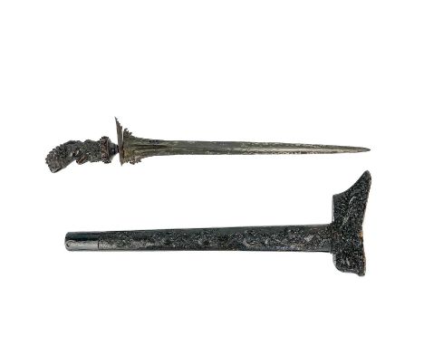 An Indonesian kris, 19th century. With carved wood handle and scabbard, the steel blade overlaid with gold and silver, full l