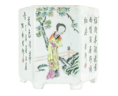 A Chinese famille rose porcelain hexagonal brush pot, late 19th century. The alternating panels painted with figures in a lan